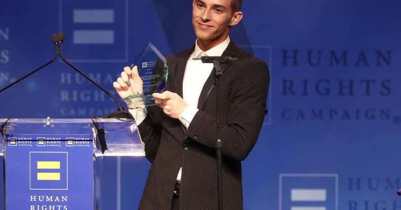 LOS ANGELES, CA - MARCH 10: Adam Rippon celebrates as he is honored with the Visibilty Award during the Human Rights Campaign 2018 Los Angeles Dinner at JW Marriott Los Angeles at L.A. LIVE on March 10, 2018 in Los Angeles, California. (Photo by Frederick M. Brown/Getty Images)