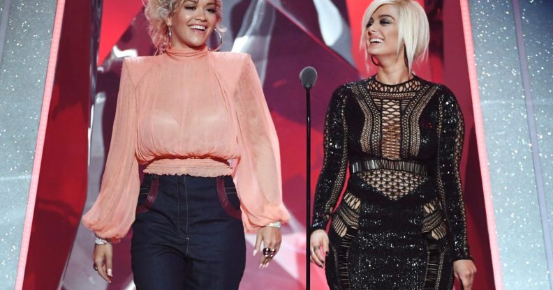 INGLEWOOD, CA - MARCH 11: Rita Ora (L) and Bebe Rexha speak onstage during the 2018 iHeartRadio Music Awards which broadcasted live on TBS, TNT, and truTV at The Forum on March 11, 2018 in Inglewood, California. (Photo by Kevin Winter/Getty Images for iHeartMedia)