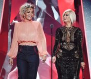 INGLEWOOD, CA - MARCH 11: Rita Ora (L) and Bebe Rexha speak onstage during the 2018 iHeartRadio Music Awards which broadcasted live on TBS, TNT, and truTV at The Forum on March 11, 2018 in Inglewood, California. (Photo by Kevin Winter/Getty Images for iHeartMedia)
