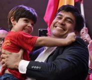 Presidential candidate of the ruling Citizens' Action Party (PAC), Carlos Alvarado, picks up his son Gabriel, during a campaign rally in San Jose, Costa Rica, on March 24, 2018. / AFP PHOTO / Ezequiel BECERRA (Photo credit should read EZEQUIEL BECERRA/AFP/Getty Images)