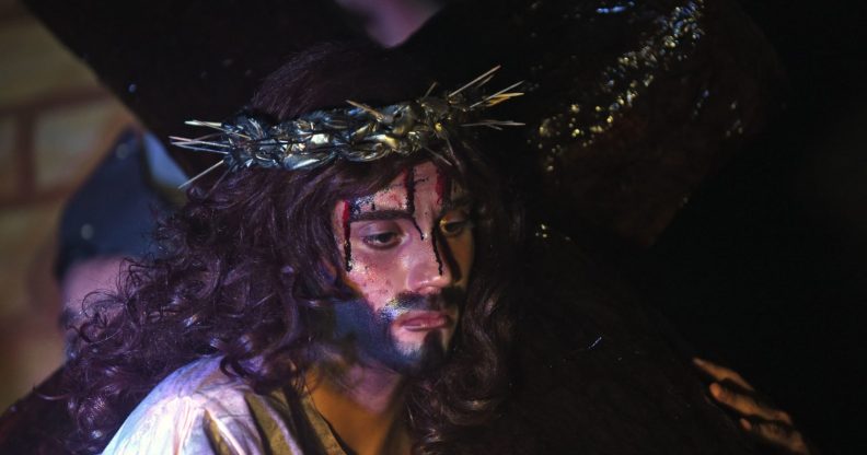 Students perform a scene from the Stations of the Cross commemorating Jesus Christ's last hours during Holy Week celebrations on March 28, 2018 in Luque, Paraguay. / AFP PHOTO / NORBERTO DUARTE (Photo credit should read NORBERTO DUARTE/AFP/Getty Images)