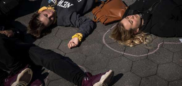 NEW YORK, NY - APRIL 20: Student activists participate in a 'die-in' to protest gun violence at Washington Square Park, near the campus of New York University, April 20, 2018 in New York City. On the anniversary of the 1999 Columbine High School mass shooting, student activists across the country are participating in school walkouts to demand action on gun reform. (Photo by Drew Angerer/Getty Images)