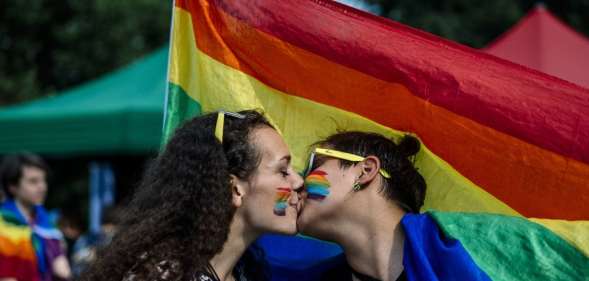 A couple kisses during the 11th Gay Pride Parade in downtown Sofia on June 9, 2018, as gays, lesbians and transsexuals march through Bulgarian capital to protest against discrimination against homosexuals and improve their integration in the society. - Thousands of people took to the streets to support LGBT rights in cities across Europe on June 9, 2018, with marchers waving rainbow flags and condemning discrimination in all its forms. (Photo by Dimitar DILKOFF / AFP) (Photo credit should read DIMITAR DILKOFF/AFP/Getty Images)