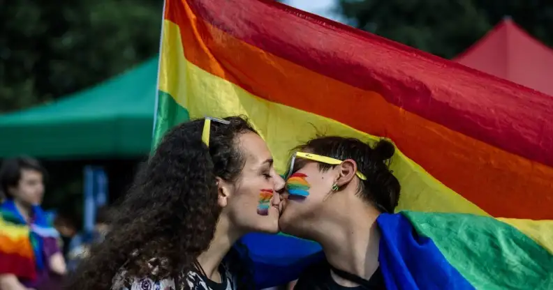 A couple kisses during the 11th Gay Pride Parade in downtown Sofia on June 9, 2018, as gays, lesbians and transsexuals march through Bulgarian capital to protest against discrimination against homosexuals and improve their integration in the society. - Thousands of people took to the streets to support LGBT rights in cities across Europe on June 9, 2018, with marchers waving rainbow flags and condemning discrimination in all its forms. (Photo by Dimitar DILKOFF / AFP) (Photo credit should read DIMITAR DILKOFF/AFP/Getty Images)