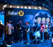 Gaming fans wait in line for freebies from Bethesda's Fallout 76 game.