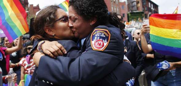 NEW YORK, NY - JUNE 24: EMT Trudy Bermudez and paramedic Tayreen Bonilla of New York City Fire Department get engaged at the annual Pride Parade on June 24, 2018 in New York City. The first gay pride parade in the U.S. was held in Central Park on June 28, 1970. (Photo by Kena Betancur/Getty Images)