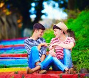 Same sex couple on rainbow stairs