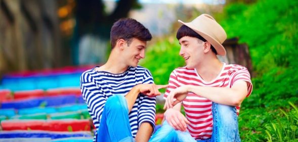 Same sex couple on rainbow stairs