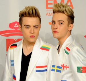 Jedward in Eurovision jackets decorated with different national flags
