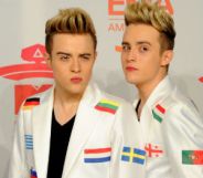 Jedward in Eurovision jackets decorated with different national flags