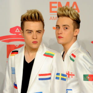 Jedward in Eurovision jackets decorated with different national flags