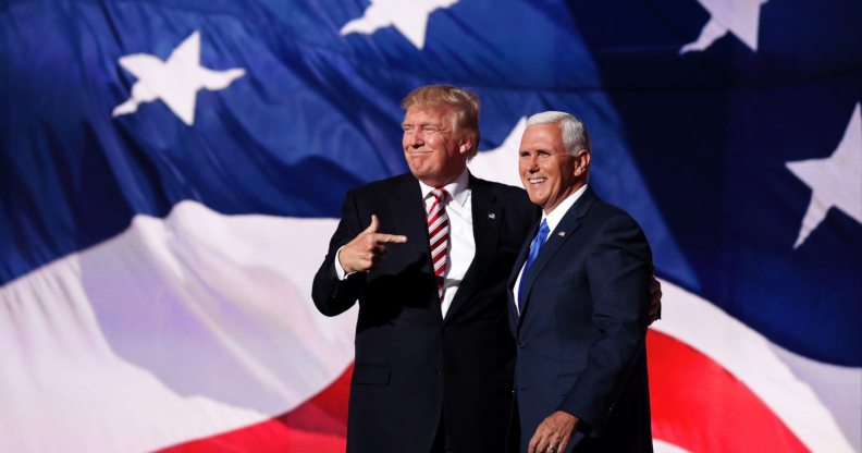 CLEVELAND, OH - JULY 20: Republican presidential candidate Donald Trump stand with Republican vice presidential candidate Mike Pence and acknowledge the crowd on the third day of the Republican National Convention on July 20, 2016 at the Quicken Loans Arena in Cleveland, Ohio. Republican presidential candidate Donald Trump received the number of votes needed to secure the party's nomination. An estimated 50,000 people are expected in Cleveland, including hundreds of protesters and members of the media. The four-day Republican National Convention kicked off on July 18. (Photo by Chip Somodevilla/Getty Images)