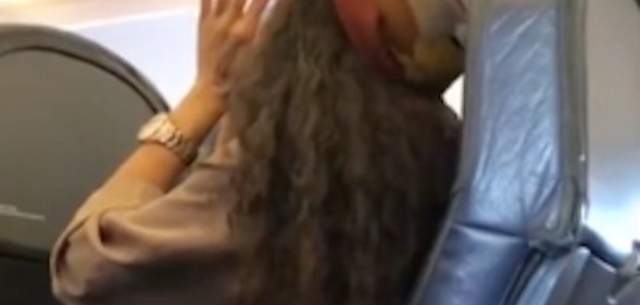 Woman yells homophobic and racist slurs at plane passenger