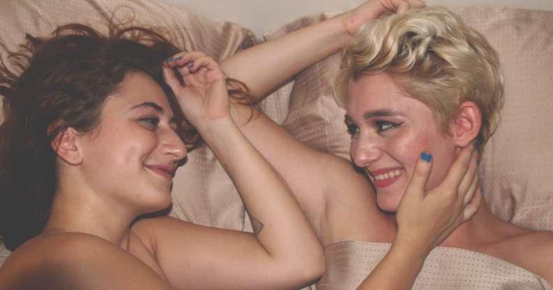Women looking satisfied in bed, which according to LGBT+ science is normal for women who have sex with women.