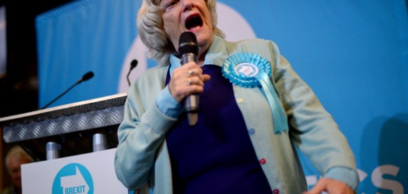 Ann Widdecombe holding a microphone