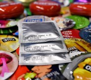 Dozens of condoms scattered on a surface