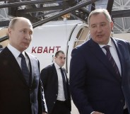 Russian President Vladimir Putin talks with Russian Deputy Prime Minister and Head of ROSCOSMOS Dmitry Rogozin