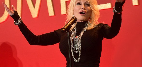 Dolly Parton performs onstage at a luncheon for the Netflix Film Dumplin' at Four Seasons Hotel Los Angeles