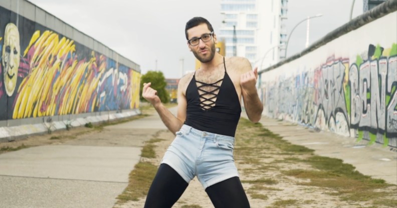A still from a video of the founder of queer protest group WERK for Peace, Firas Nasr, dancing at the Berlin Wall