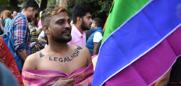 A man with "legal now" takes part in a pride parade in Delhi on November 25, 2018, the first since the Supreme Court decriminalised gay sex, a landmark moment defining 2018