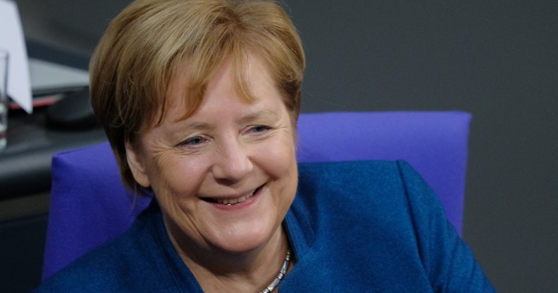 German Chancellor Angela Merkel sits down at the Bundestag