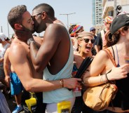 Two men kissing at Israel Pride