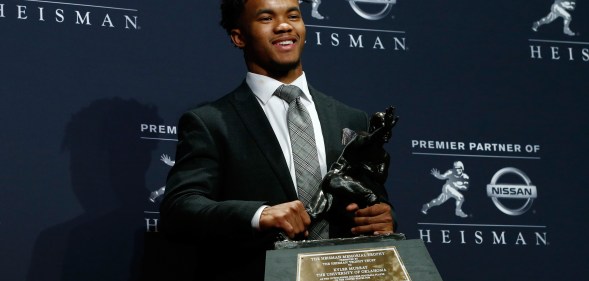 Kyler Murray of Oklahoma poses for a photo after winning the 2018 Heisman Trophy on December 8