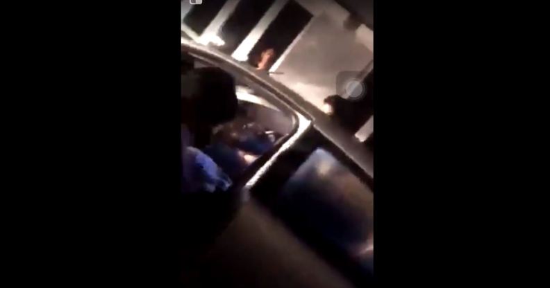 Still from video of Malaysian men being attacked from car circulated on social media.