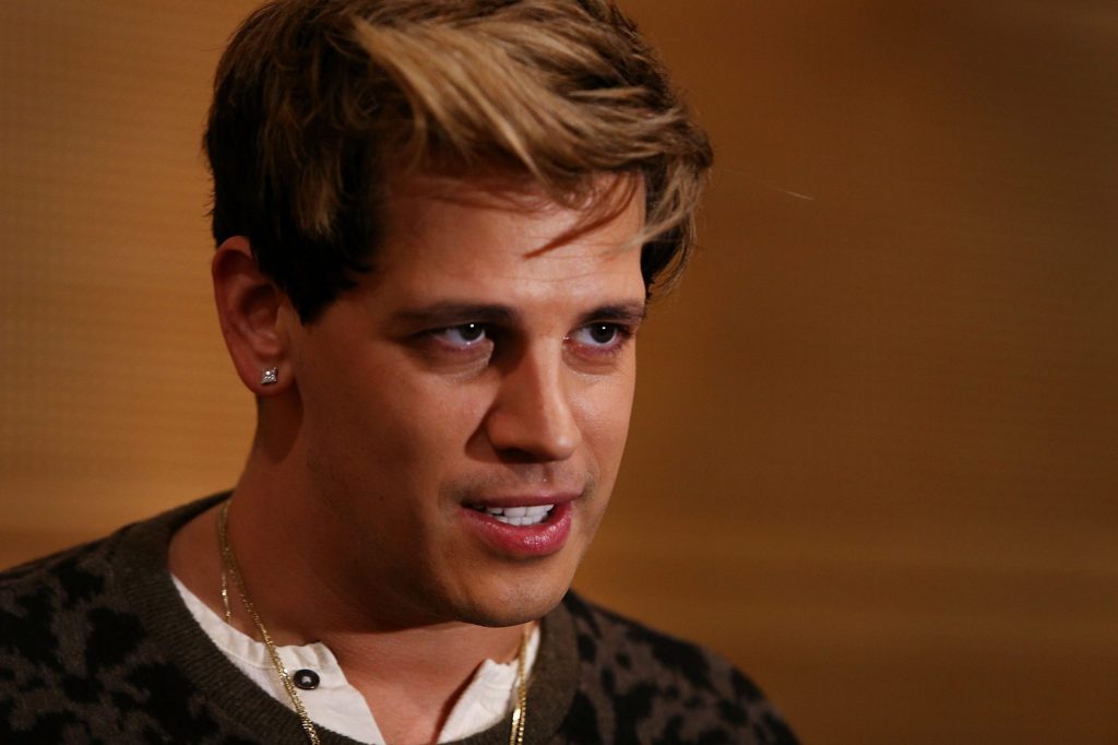 Milo Yiannopoulos reacts during a press conference on arrival at the Sydney International Airport on November 29, 2017