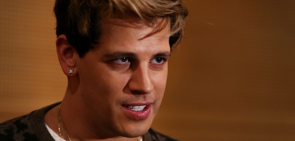 Milo Yiannopoulos reacts during a press conference on arrival at the Sydney International Airport on November 29, 2017