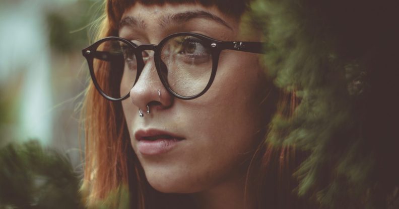 Girl with glasses and septum piercing