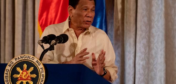 Philippine President Rodrigo Duterte speaking at a podium