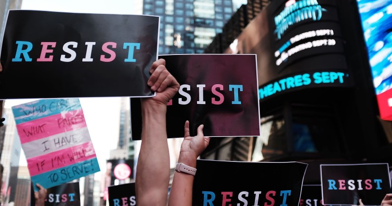 Dozens of protesters gather in Times Square near a military recruitment center to show their anger at President Donald Trump's decision to reinstate a ban on trans folk from serving in the militar. (Spencer Platt/Getty Images)