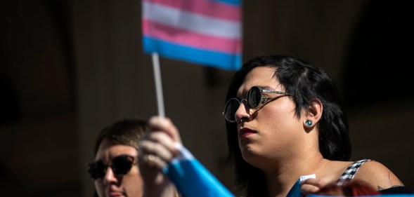 LGBT activists rally in support of transgender people on the steps of New York City Hall in October 2018