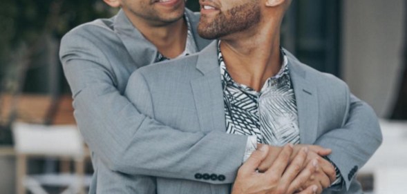 New York City married couple Alex Majkowski and Taray Carey embrace