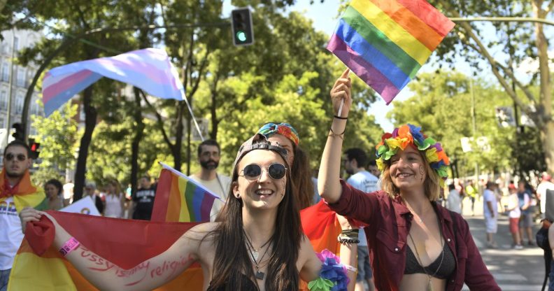 Participants wave Rainbow Flags as they take part in the WorldPride 2017 parade in Madrid