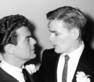 Two grooms looking at each other lovingly