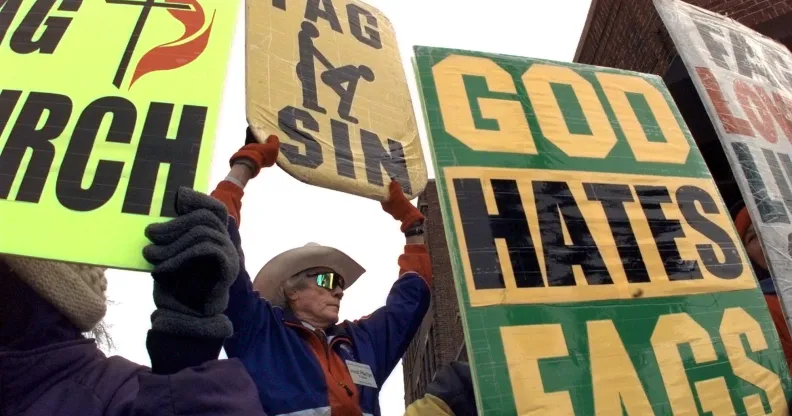 Rev. Fred Phelps from the Westboro Baptist Church of Topeka, Kansas holds a 'God Hates Fags' sign