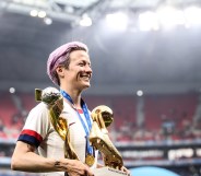 Megan Rapinoe with world cup trophy