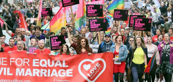 Equal rights campaigners take part in a march through Belfast on July 1, 2017 to protest against the ban on same-sex marriage.