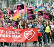 Equal rights campaigners take part in a march through Belfast on July 1, 2017 to protest against the ban on same-sex marriage.