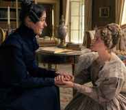 Anne Lister sitting down, holding hands with Ann Walker who is on bended knee