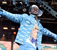 Lil Nas X on the Pyramid stage with his arms spread