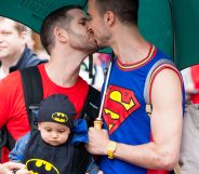 Two men share a kiss as they take part in the LGBT parade during the annual Pride In London parade on June 28, 2014 in London, England.