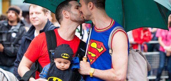 Two men share a kiss as they take part in the LGBT parade during the annual Pride In London parade on June 28, 2014 in London, England.
