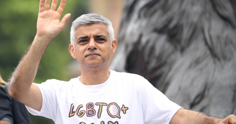 Sadiq Khan waving, wearing an "LGBTQ ally" t-shirt