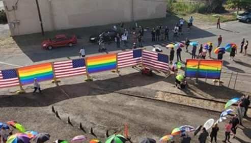 Parasel-armed parents protect children attending a drag show from protesters (Facebook/Charles Rozanski)