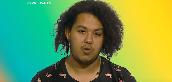 Abderrahim El Habachi against a multi-coloured background