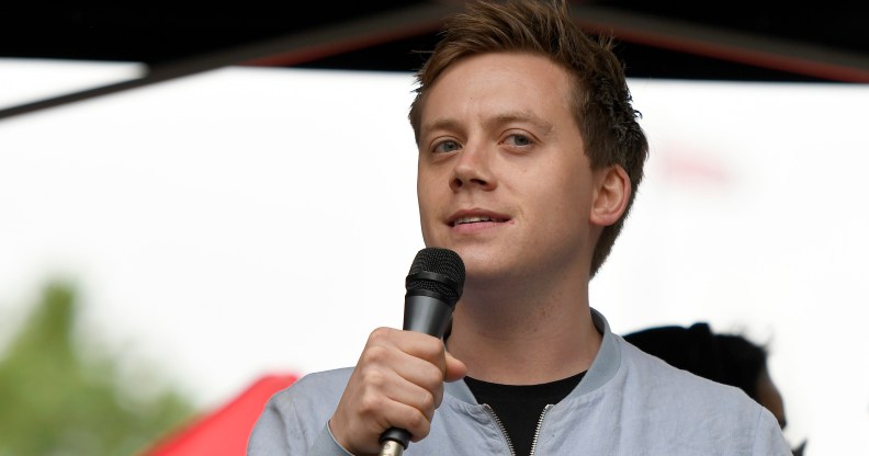 Guardian columnist Owen Jones speaks to the crowd during an Anti-Trump protest in London.