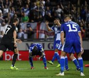 Bristol Rover players (right) on the pitch with Brighton & Hove Albion at Memorial Stadium, Bristol (Getty Images/Alex Davidson)